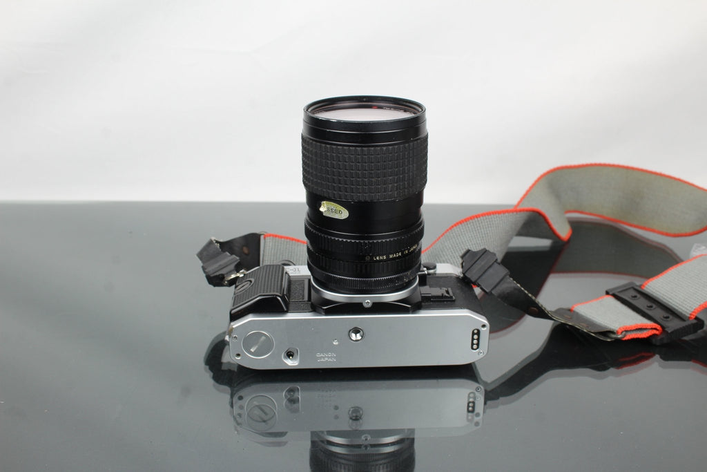 Canon AE - 1 Program + Tokina AT - X 28 - 85mm Canon FD mount lens - Dutch|Thrift